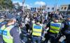 Demo Anti-Lockdown Berujung Rusuh, Polisi Tangkap Puluhan Orang Pendukung Teori Konspirasi