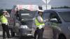 Pintu Masuk dan Keluar Tol Keramasan Sumsel Dijaga Ketat Polisi - Bagian 3
