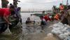 3.600 Karung Berisi Pasir dan Batu Tutup Tanggul Jebol di Pelabuhan Tanjung Emas - Bagian 3