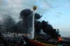 Helikopter Water Bombing Bantu Padamkan Kebakaran Kapal Nelayan 