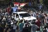 Pembalap Naik Mobil Bak Bawa Bendera Merah Putih saat Parade MotoGP Mandalika - Bagian 1