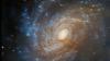 Hubble Tangkap Galaksi Terang di Balik Nebula Gelap, Begini Penampakannya
