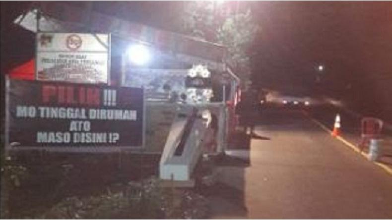 Viral Peti Jenazah di Posko Desa Tombasian Bawah sebagai Pengingat Bahaya Covid-19