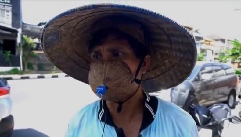 Viral Juru Parkir di Denpasar Pakai Masker Batok Kelapa, Kena Tegur Satpol PP