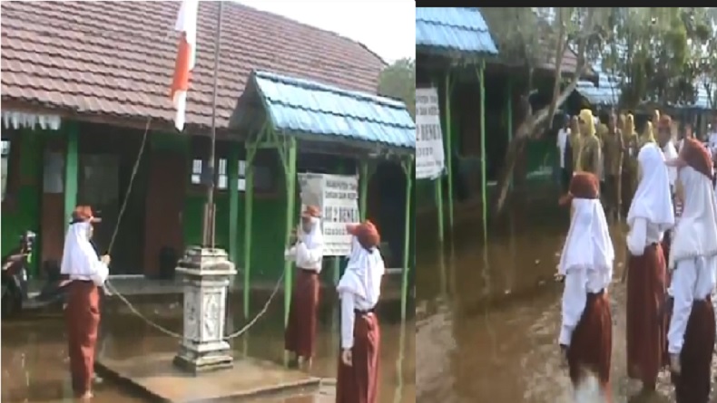 Momen Siswa SD Tanah Laut Kalsel Upacara di Tengah Banjir Bikin Terenyuh