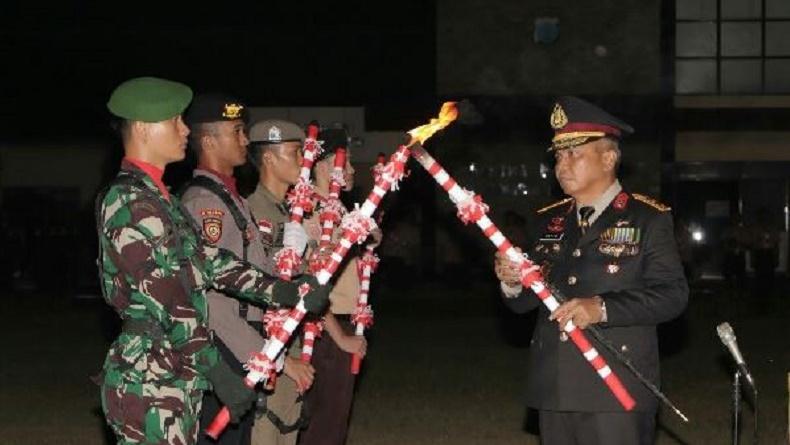 Jelang HUT ke-78 RI, TNI-Polri di Sulut Gelar Pawai Obor Pasukan Gabungan