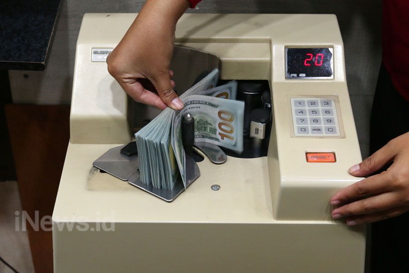 Dolar AS Melemah Setelah The Fed Keluarkan Stimulus Baru