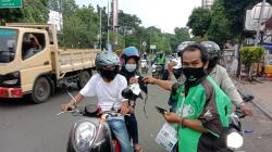Terdepan dalam Protokol Kesehatan, Mitra Gojek Serang Raya Bagikan Masker dan Edukasi Masyarakat