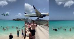 Unik! Pulau Dekat Bandara, Pesawat Landing di Atas Kepala Turis