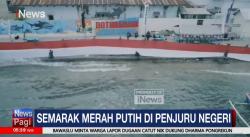 Bendera Merah Putih 200 Meter Dibentangkan di Pantai Hiu Paus
