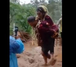 Viral Pengantin Pria Gendong Mempelai Wanita di Wonosobo Terobos Jalan Longsor<