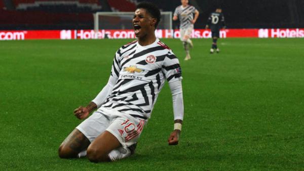 Striker Manchester United Marcus Rashford merayakan golnya ke gawang Paris Saint-Germain (PSG) pada matchday pertama Grup H Liga Champions di Stadion Parc des Princes, Rabu (21/10/2020) dini hari WIB. (Foto: UEFA)