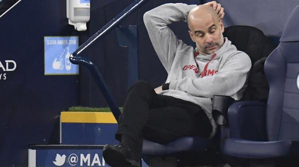 Pelatih Manchester City Pep Guardiola bereaksi saat timnya kalah 0-2 dari Manchester United pada pekan ke-27 Liga Inggris 2020/2021 di Etihad Stadium, Minggu (7/3/2021) malam WIB. (Foto: REUTERS)