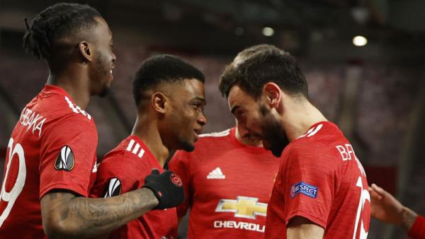 Man Utd Amad Diallo Amad Diallo (kedua kiri) merayakan golnya ke gawang AC Milan pada leg pertama 16 besar Liga Europa di Old Trafford, Jumat (12/3/2021) dini hari WIB. (Foto: REUTERS)