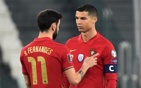Cristiano Ronaldo dan Bruno Fernandes Matchday kedua Kualifikasi Piala Dunia 2022 Zona Eropa kembali berlangsung Sabtu (27/3/2021) malam hingga Minggu, (28/3/2021) dini hari WIB. (Foto: Reuters)