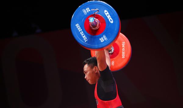 Eko Yuli Irawan 3 Lifter Eko Yuli Irawan bikin bangga Indonesia. Dia meraih medali perak Olimpiade Tokyo 2020 di kelas 61 kg putra, Minggu (25/7/2021) sore WIB. (Foto: Reuters)