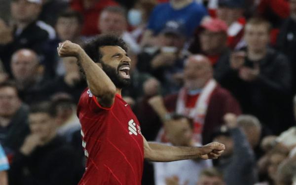 Winger Liverpool, Mohamed Salah merayakan gol ke gawang AC Milan dalam laga Liga Champions 2021/2022 di Stadion Anfield, Kamis (15/9/2021). (Foto: REUTERS/Phil Noble)