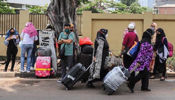 22 Mpi Rusun 1 Pelaku perjalanan luar negeri hendak menjalani karantina Covid-19 di Rusun Pasar Rumput. (Foto MNC Portal).
