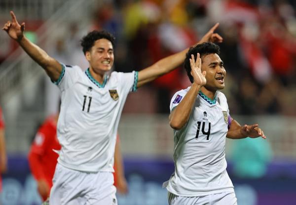 Kapten Timnas Indonesia Asnawi Mangkualam (14) mer Kapten Timnas Indonesia Asnawi Mangkualam (14) merayakan golnya ke gawang Vietnam pada matchday 2 Piala Asia 2023 di Stadion Abdullah bin Khalifa, Doha, Qatar, Jumat (19/1/2024). (Foto: REUTERS)