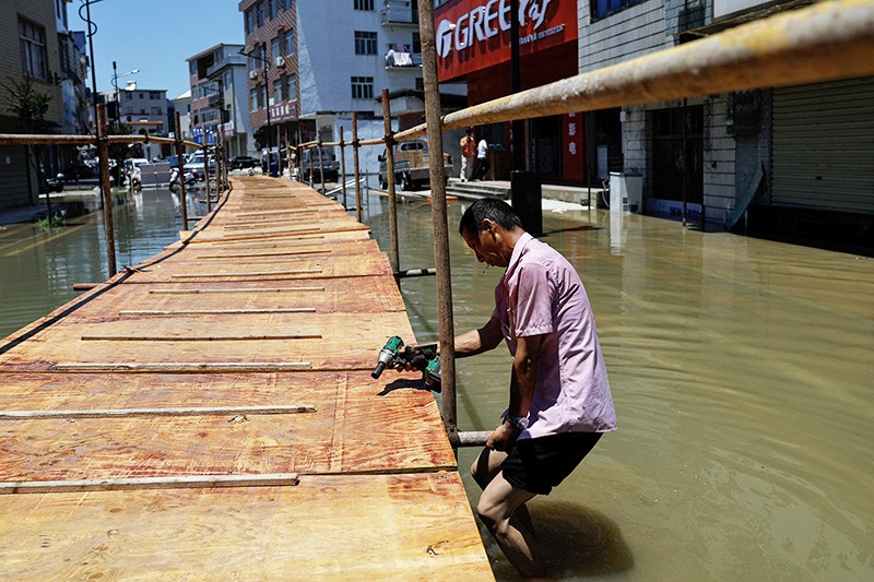 Banjir di China Belum Surut, Ratusan Ribu Warga Mengungsi - Bagian 2