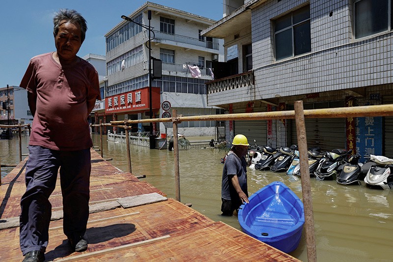 Banjir di China Belum Surut, Ratusan Ribu Warga Mengungsi - Bagian 1