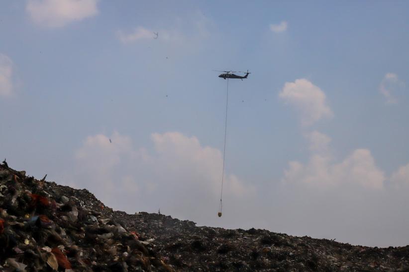 Kebakaran TPA Jatiwaringin Masuk Hari ke-10, Helikopter Water Bombing Masih Beroperasi - Bagian 2